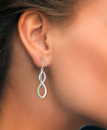 Load image into Gallery viewer, Platinum over Sterling Silver_Diamond Fascination® Diamond Accent Sterling Silver Graduated Infinity Drop Earrings - iHeart Jewels_I_Heart_2